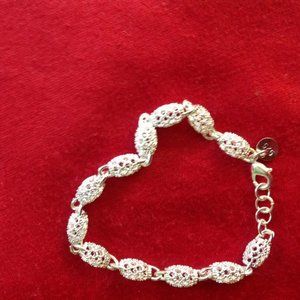 STERLING SILVER CHARM BRACELET.(BRAND NEW)